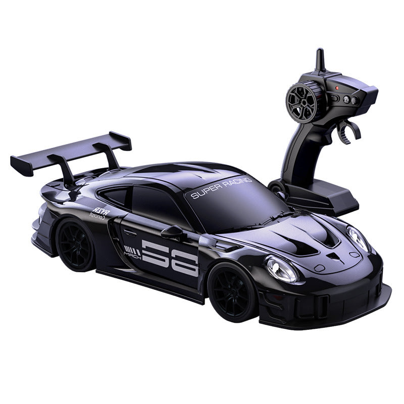 Black RC drift car with pistol-grip remote control on a white background