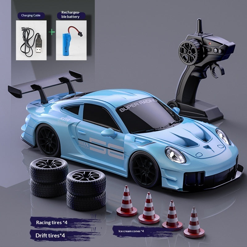 Blue RC drift car set with remote control, racing tyres, drift tyres, cones and charging accessories