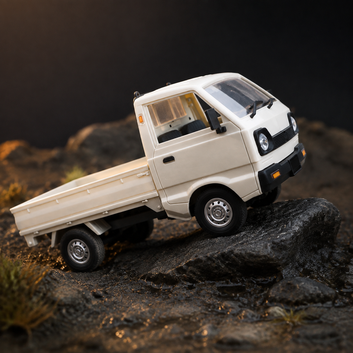 White 1:16 rechargeable mini RC truck climbing dark rocks