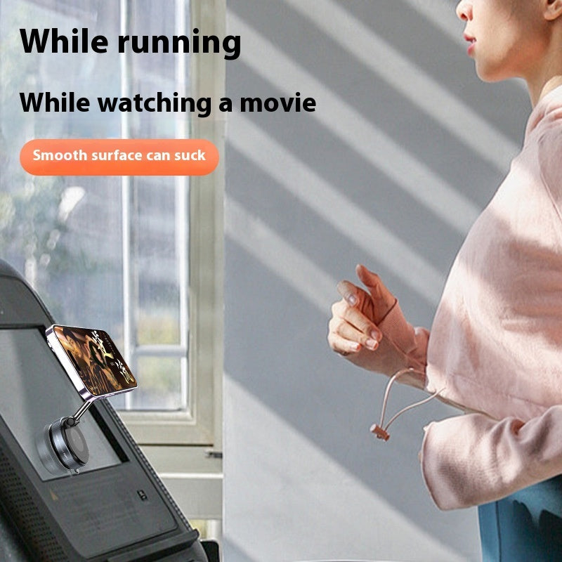Vacuum magnetic phone holder attached to a smooth window for hands-free viewing